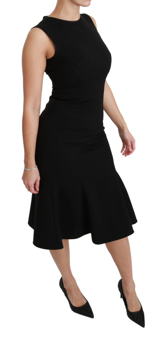Vestido de tubo de lana elástica con vuelo y corte entallado en negro de Dolce & Gabbana