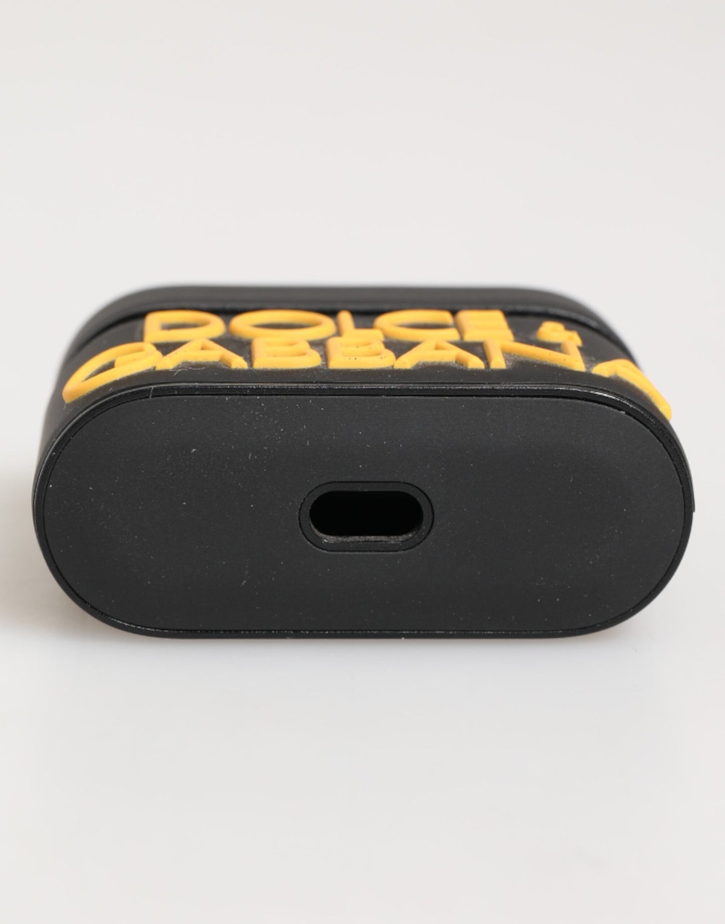 Funda para AirPods Dolce & Gabbana negra y amarilla de caucho con logotipo en relieve