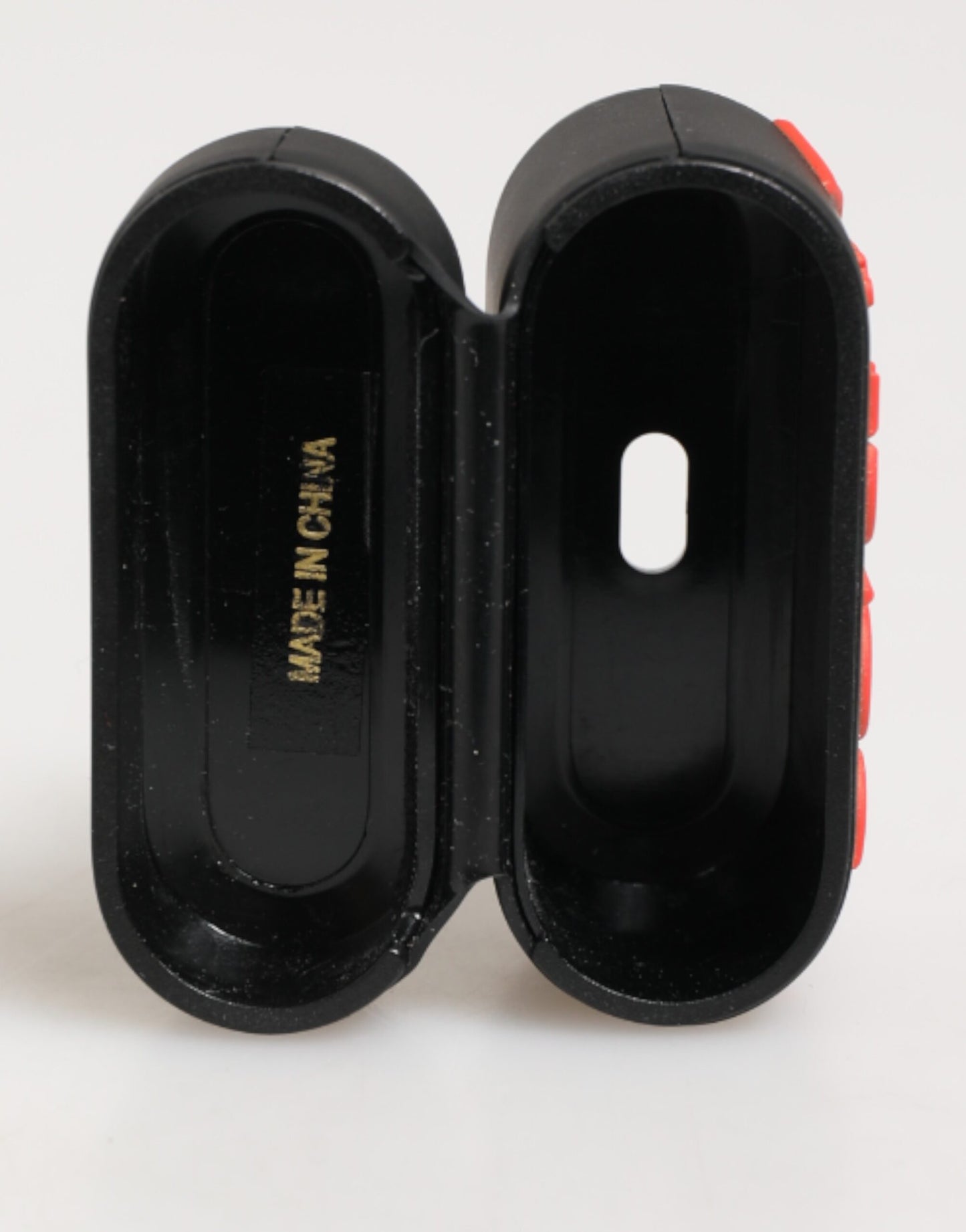Funda para Airpods Dolce & Gabbana negra, naranja, de goma con logo grabado en relieve
