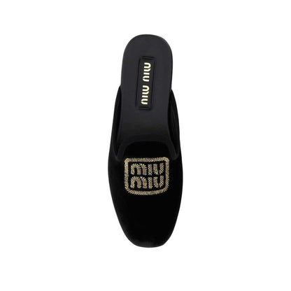 Mules Miu Miu de piel de becerro negras