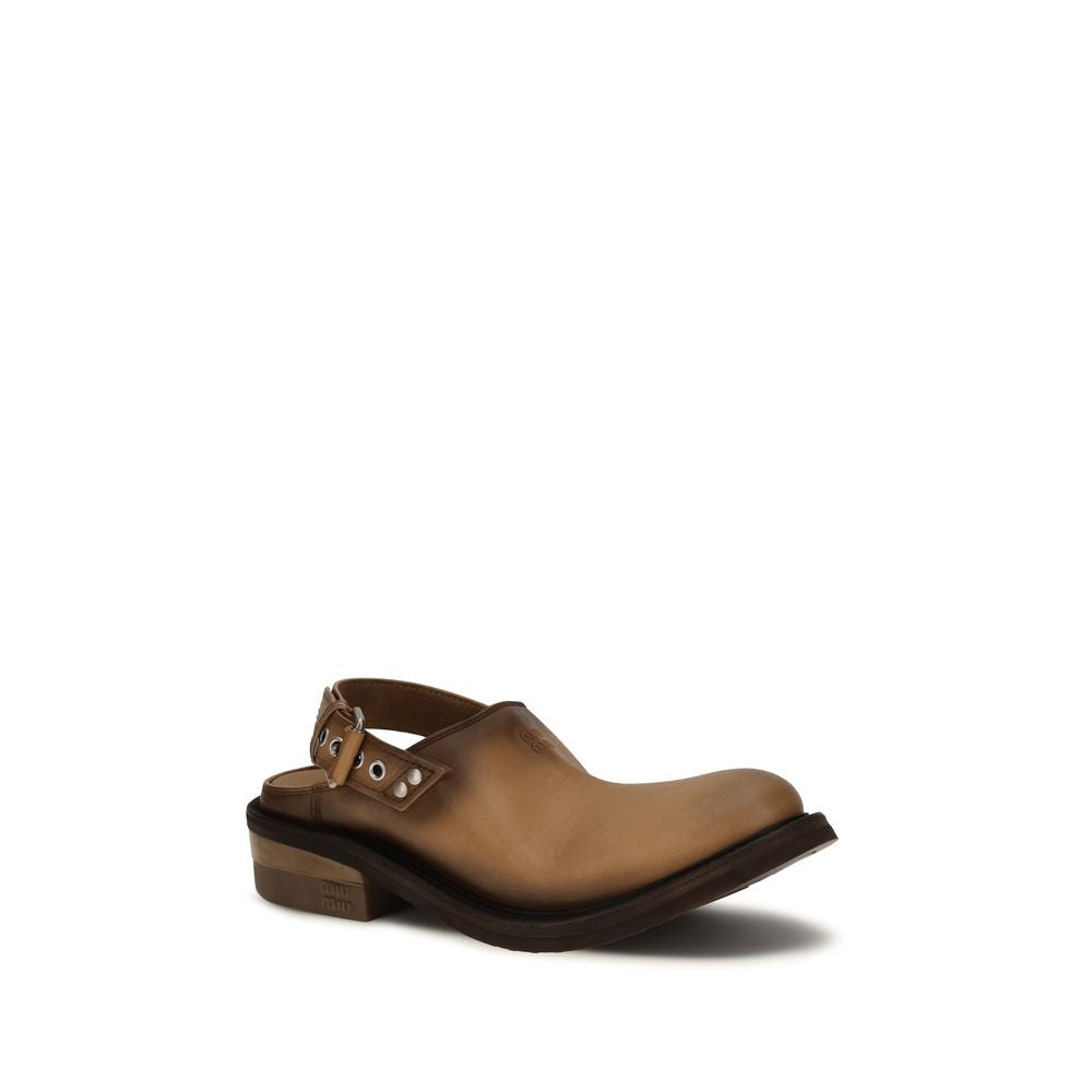 Mules Miu Miu en cuir de veau marron, modèle Bos Taurus