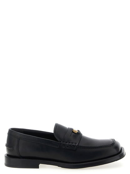 Mocasines Moschino de terciopelo negro y piel sin cordones
