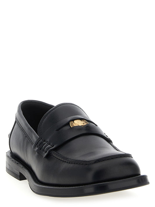 Mocasines Moschino de terciopelo negro y piel sin cordones