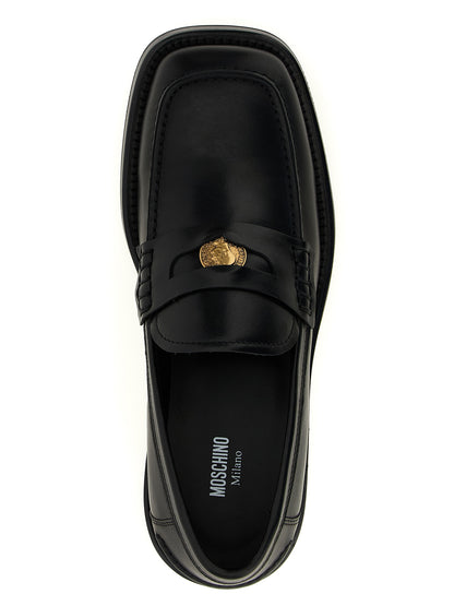 Mocasines Moschino de terciopelo negro y piel sin cordones