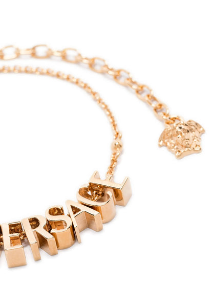 Pulsera metálica dorada de Versace