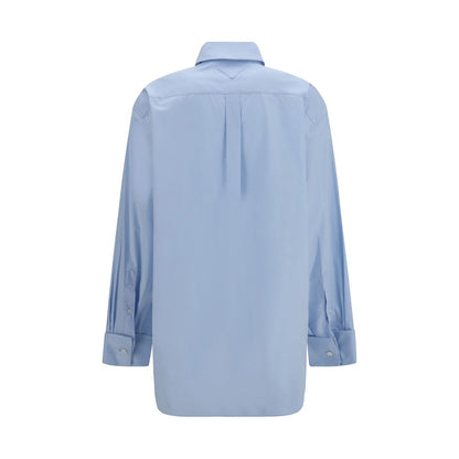 Chemise en coton bleu avec coupe structurée et touche moderne de Prada