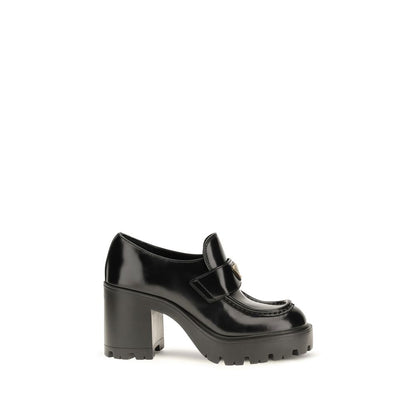 Mocasines de plataforma Prada en piel de becerro negra Bos Taurus