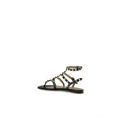 Sandales plates Valentino Garavani en cuir noir Bos Taurus