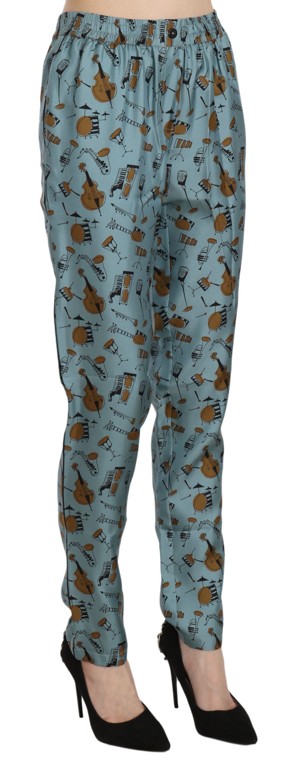 Pantalones pitillo estampados con instrumentos musicales azules de Dolce & Gabbana