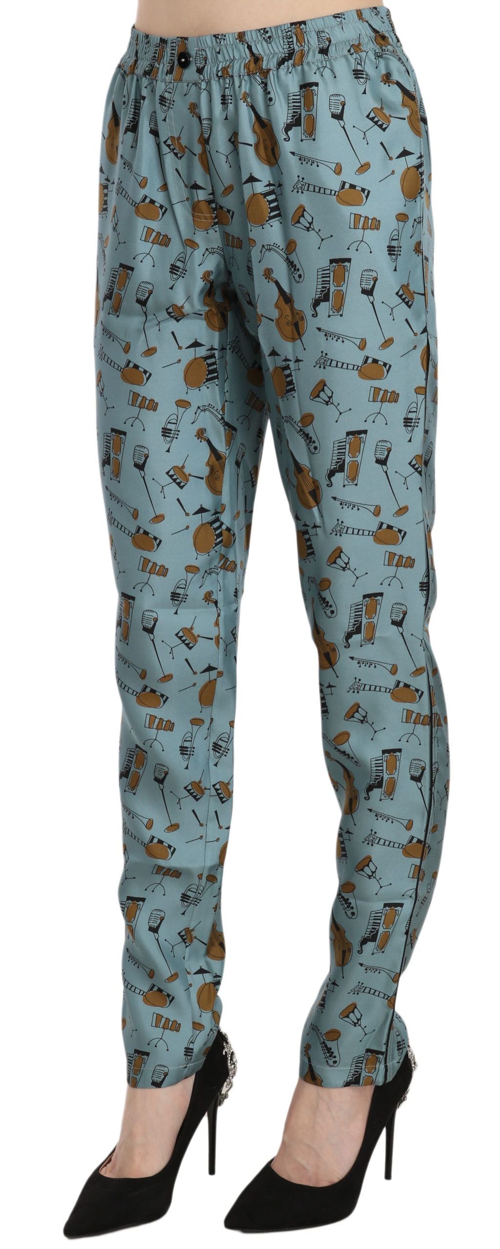 Pantalones pitillo estampados con instrumentos musicales azules de Dolce & Gabbana