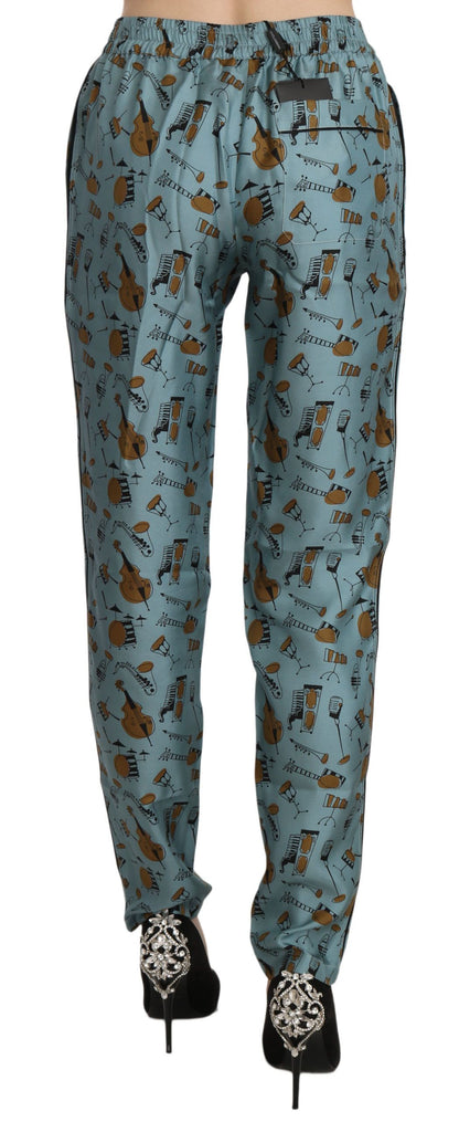 Pantalones pitillo estampados con instrumentos musicales azules de Dolce & Gabbana