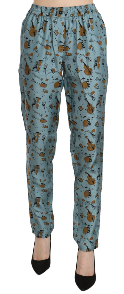 Pantalones pitillo estampados con instrumentos musicales azules de Dolce & Gabbana