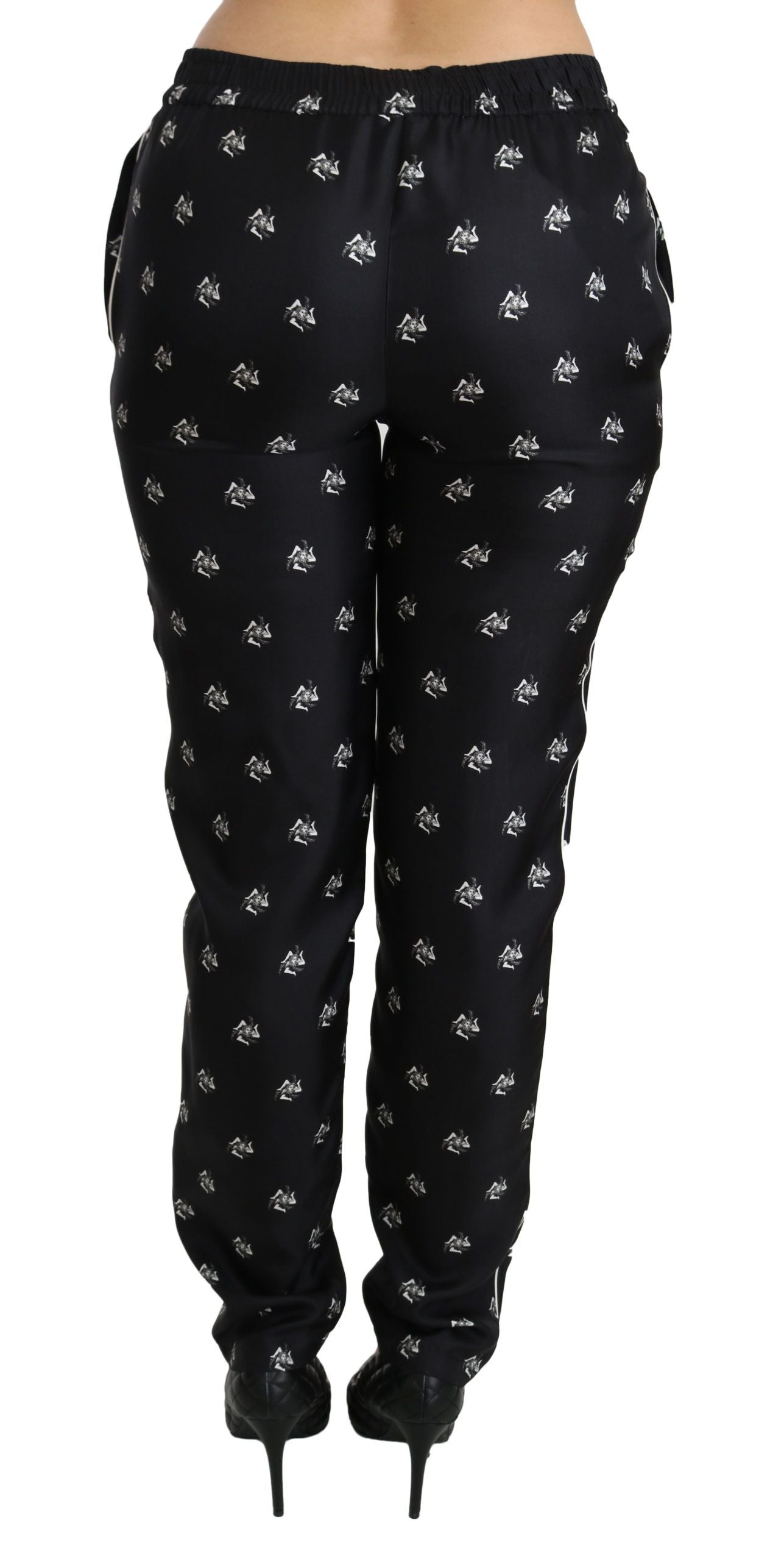 Pantalones pitillo de seda de talle medio con estampado negro de Dolce & Gabbana