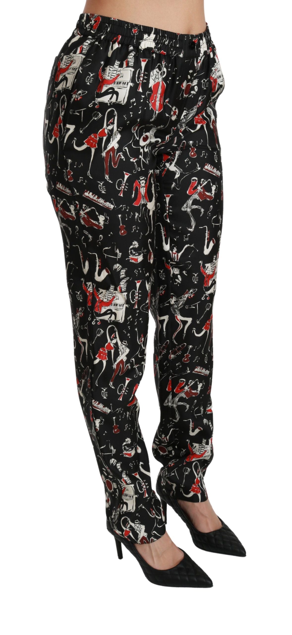 Pantalones de seda negros de talle medio con diseño de instrumentos de Dolce & Gabbana