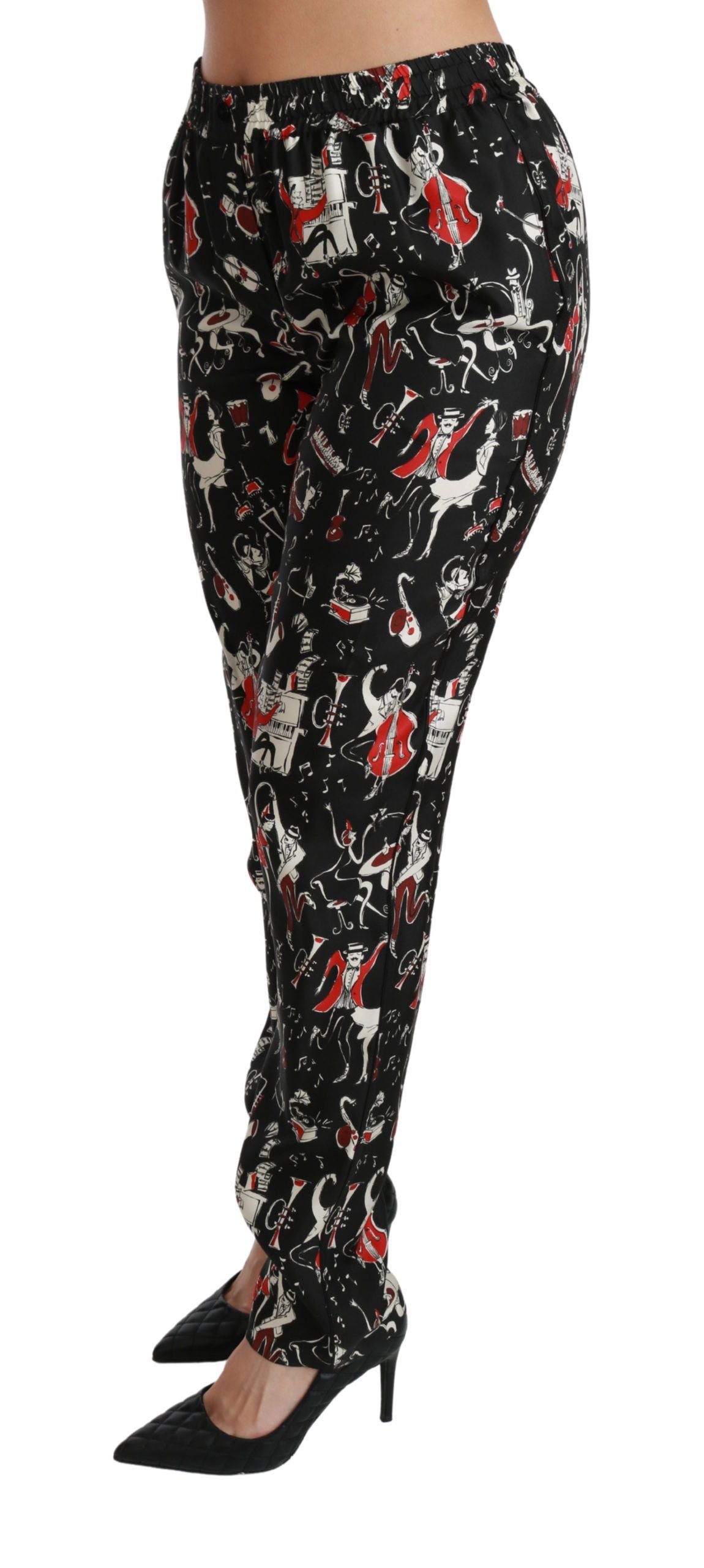 Pantalones de seda negros de talle medio con diseño de instrumentos de Dolce & Gabbana