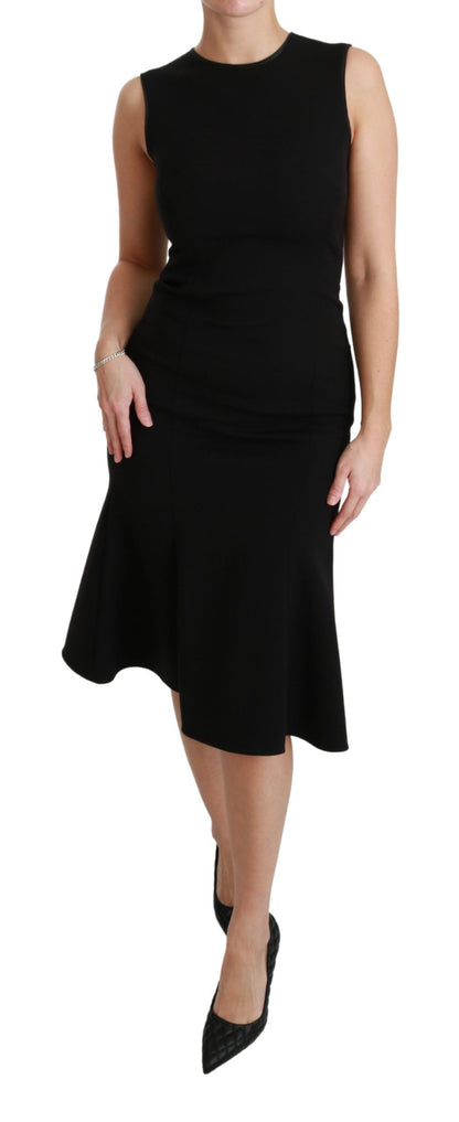 Vestido de tubo de lana elástica con vuelo y corte entallado en negro de Dolce & Gabbana