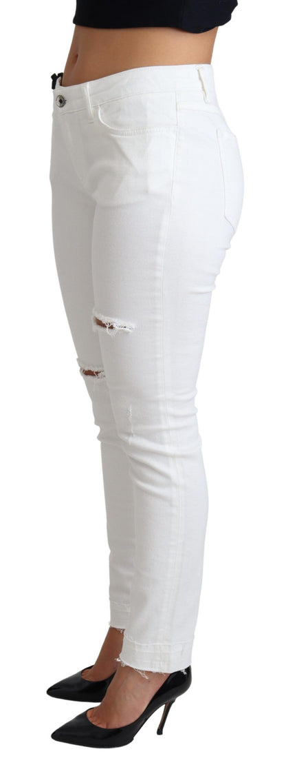 Jeans ajustados Dolce & Gabbana de algodón elástico blanco rasgado