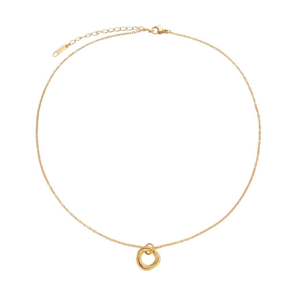 Delicate gold-plated necklace with three interlocking circle rings forming a minimalist knot pendant on cream background