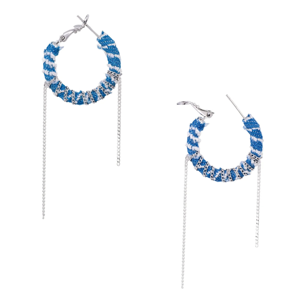 Medium hoop earrings wrapped in blue striped denim fabric with dangling silver chains on white background.