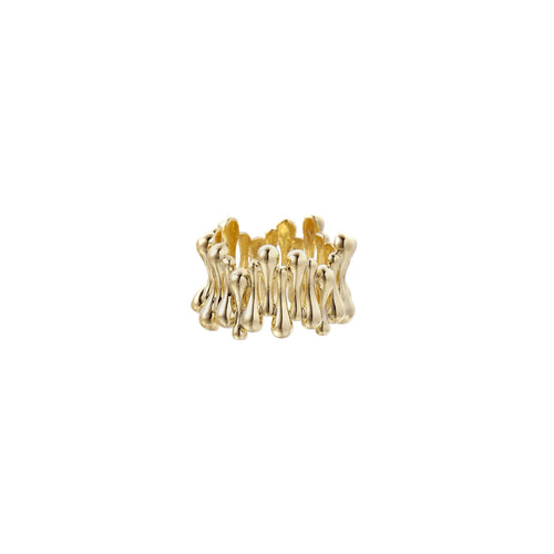 Gold-plated brass ring with sculptural petal-like elements in a wide band design on beige background