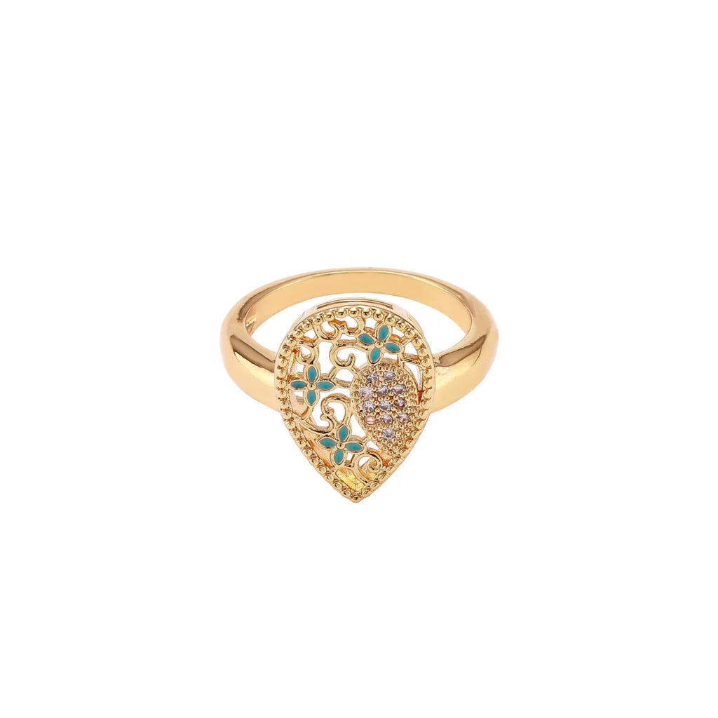 Teardrop-shaped gold-plated ring with turquoise enamel flowers and crystal pavé detail on cream background