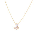 Gold-plated butterfly pendant with iridescent mother of pearl inlay on delicate chain against cream background.