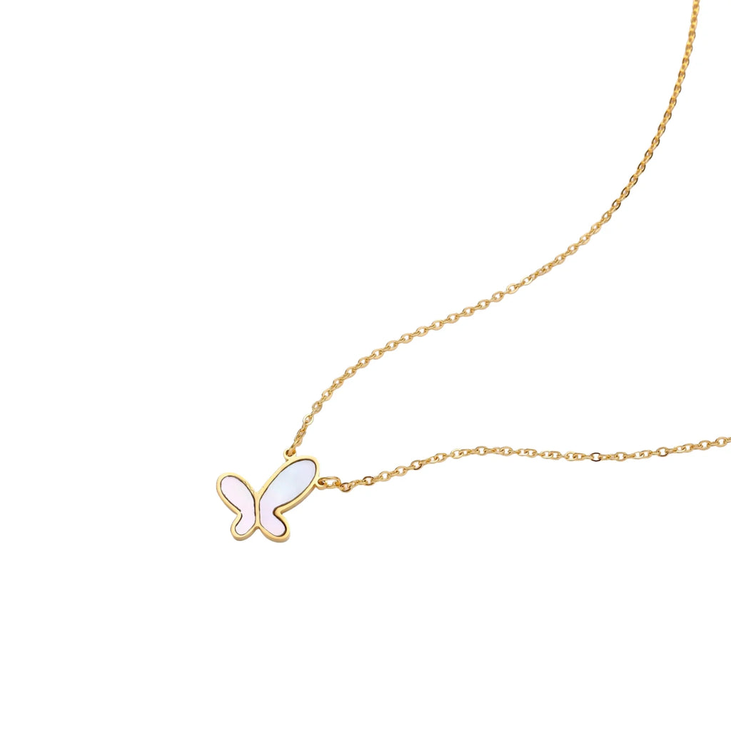 Gold-plated butterfly pendant with iridescent mother of pearl inlay on delicate chain against cream background.