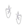 Silver star studs with crescent moon cutouts and zirconia stones connected by delicate chains on white background