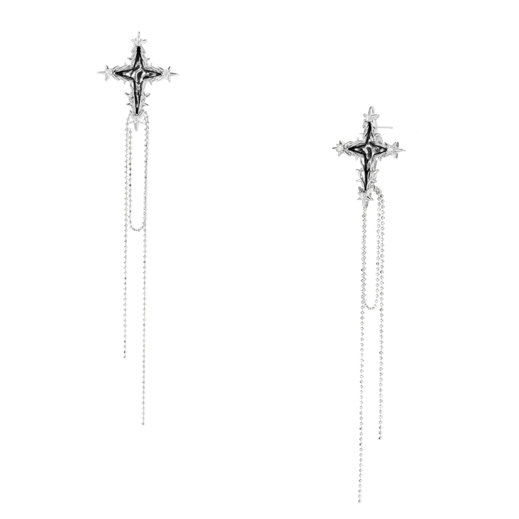 Long silver threader earrings with ornate cross-star design and delicate dual chain tassels on white background
