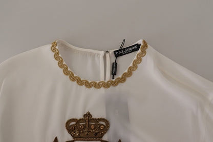Blusa de seda blanca con corona DG dorada y cristales de Dolce & Gabbana