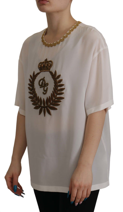 Blusa de seda blanca con corona DG dorada y cristales de Dolce & Gabbana