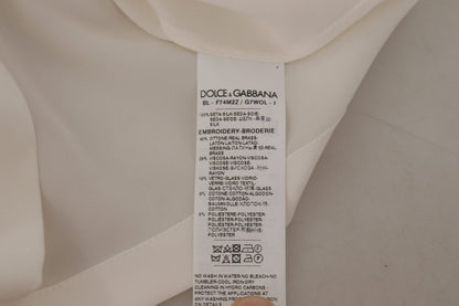 Blusa de seda blanca con corona DG dorada y cristales de Dolce & Gabbana