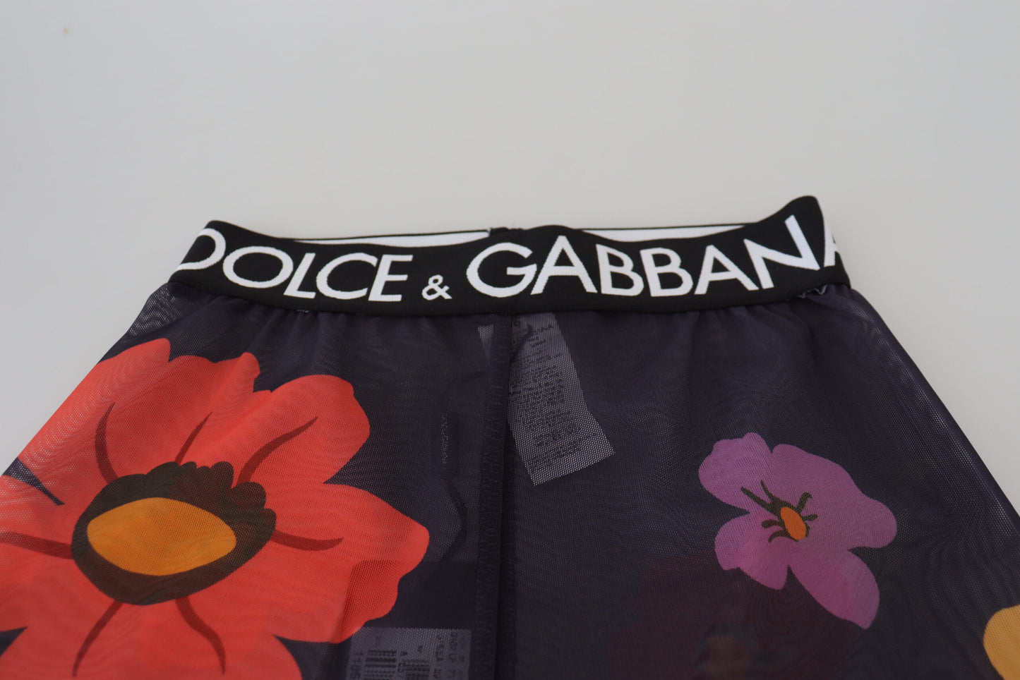 Pantalones ajustados con cintura elástica y estampado floral negros de Dolce & Gabbana