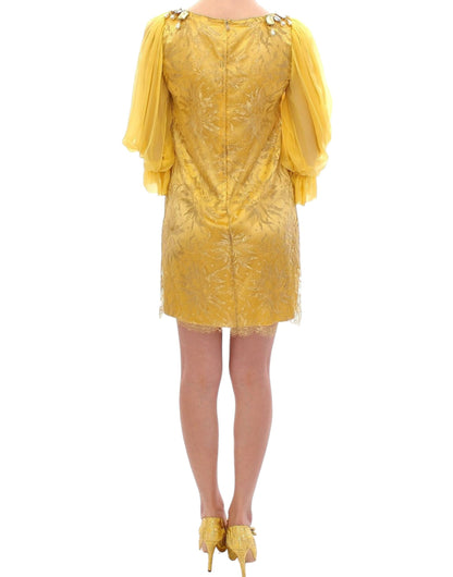 Vestido mini de encaje amarillo y cristales de Dolce & Gabbana