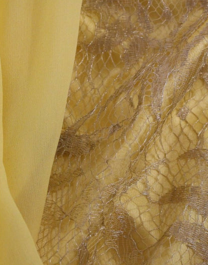 Vestido mini de encaje amarillo y cristales de Dolce & Gabbana