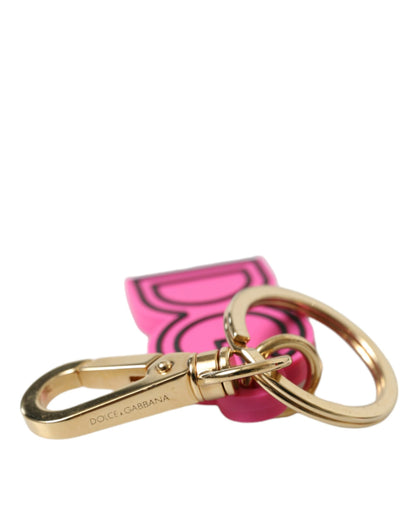 Llavero Dolce & Gabbana rosa de goma con logo DG de metal dorado