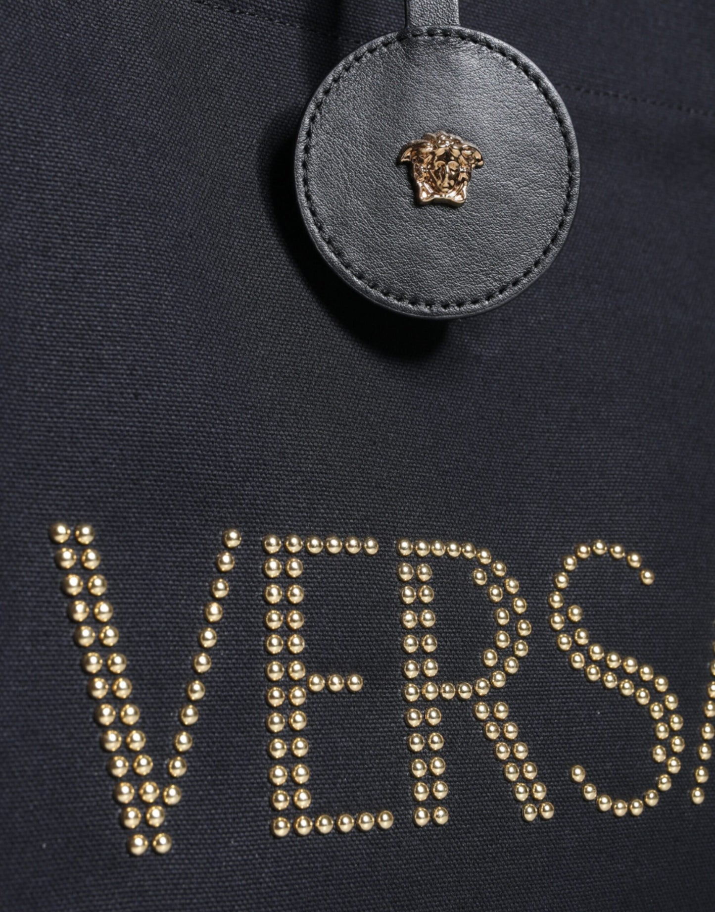 Bolso tote cruzado de mano Versace negro de lona y cuero con logo