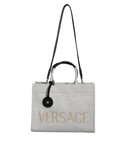 Bolso tote cruzado de lona y cuero con asa superior, logo y color blanco de Versace