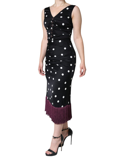 Vestido midi de seda negra con lunares, escote en V y borlas de Dolce & Gabbana