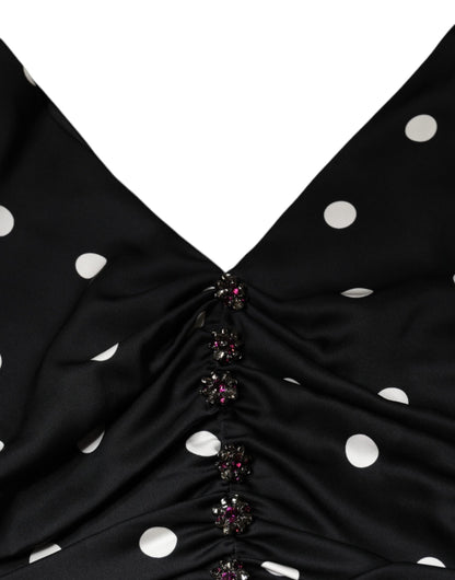 Vestido midi de seda negra con lunares, escote en V y borlas de Dolce & Gabbana