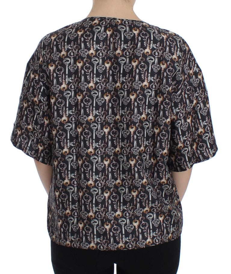 Blusa de seda gris con estampado de llave dorada Dolce & Gabbana