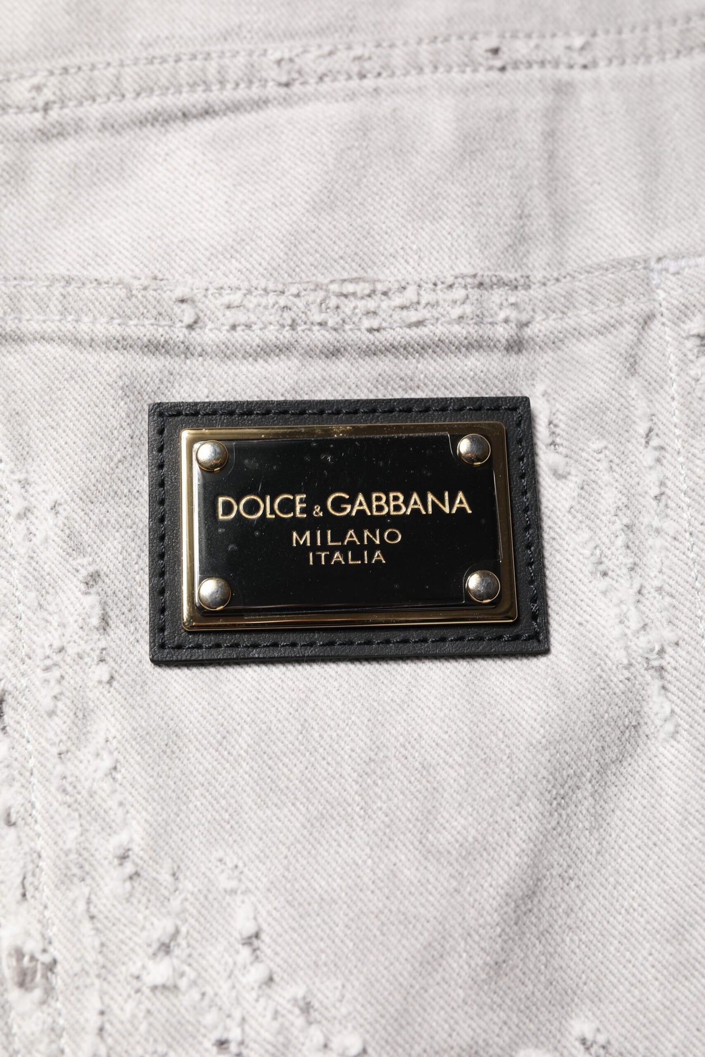 Pantalones cortos vaqueros bermuda desgastados de color gris claro para hombre de Dolce & Gabbana