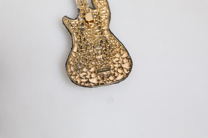 Broche de alfiler de guitarra con logo de latón dorado y abalorios Dolce & Gabbana