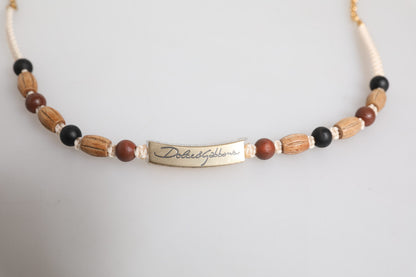 Collar con colgante de cuentas de madera negras y doradas con el logo de Dolce & Gabbana