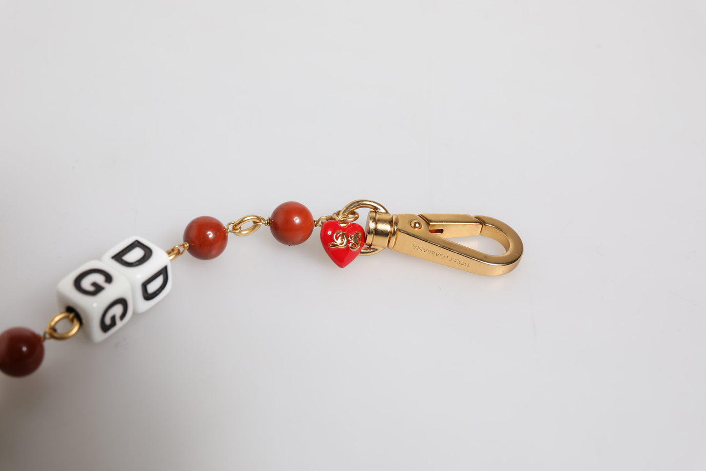 Pulsera con dados DG de Dolce & Gabbana en latón dorado multicolor con cadena