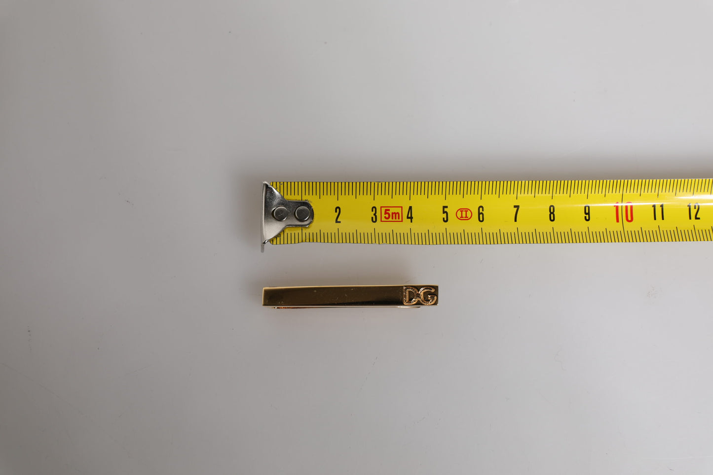 Barra de pasador de corbata con logo de latón dorado de Dolce & Gabbana