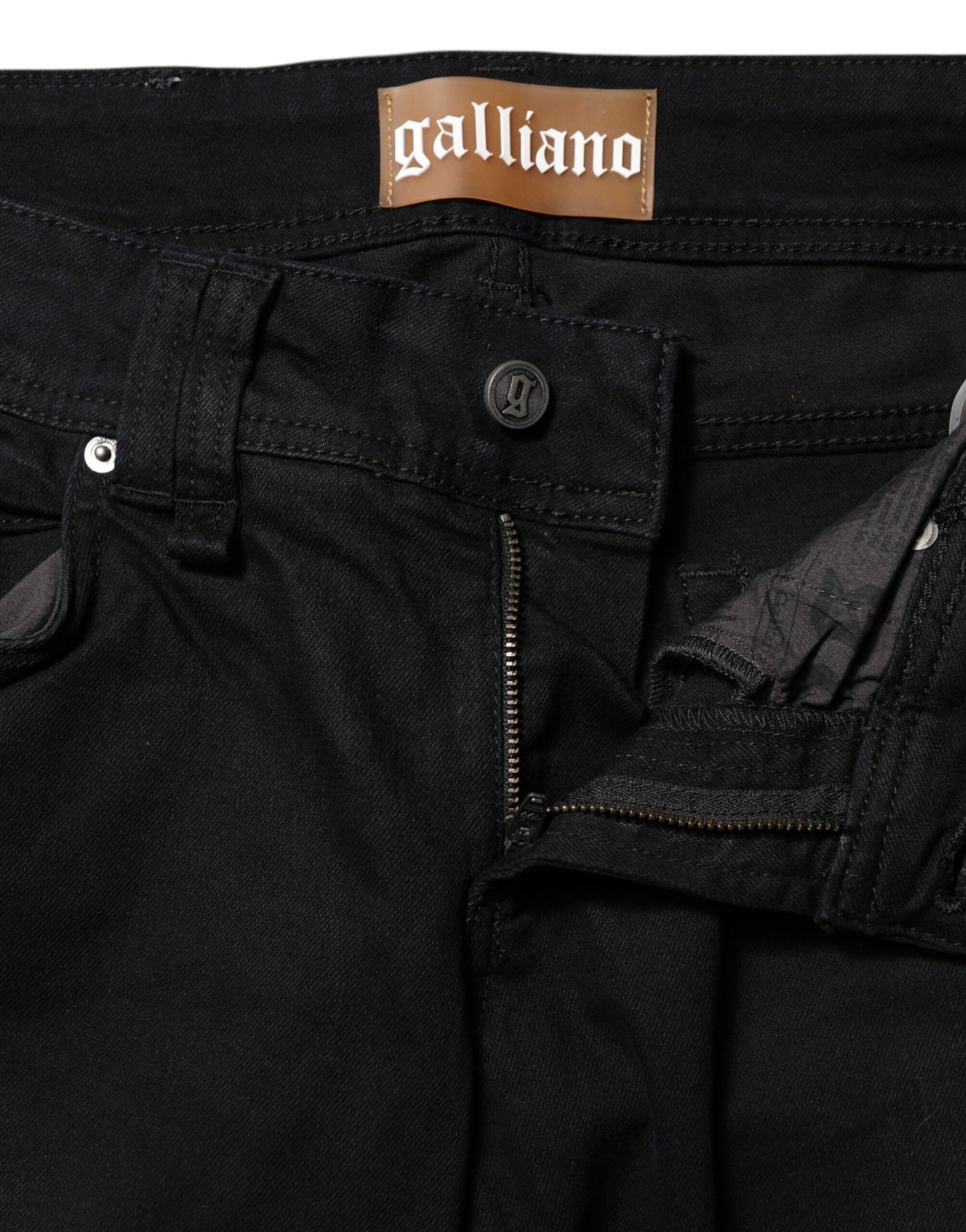 Vaqueros cónicos de tiro medio de algodón negro de John Galliano