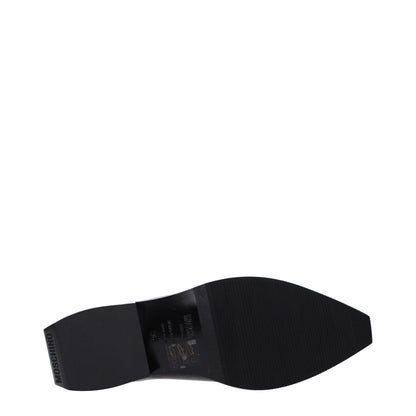 Mules de cuero negro Moschino