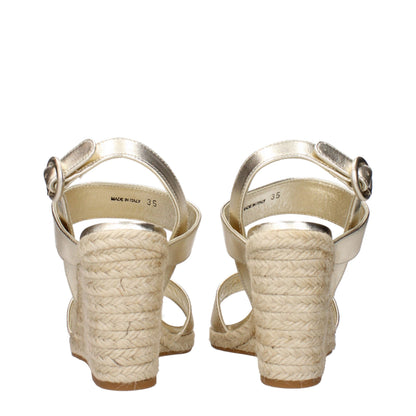 Sandalias de cuña Prada de cuero dorado