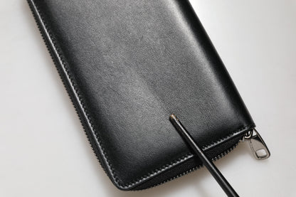 Cartera continental Dolce & Gabbana de cuero negro con cremallera y placa DG